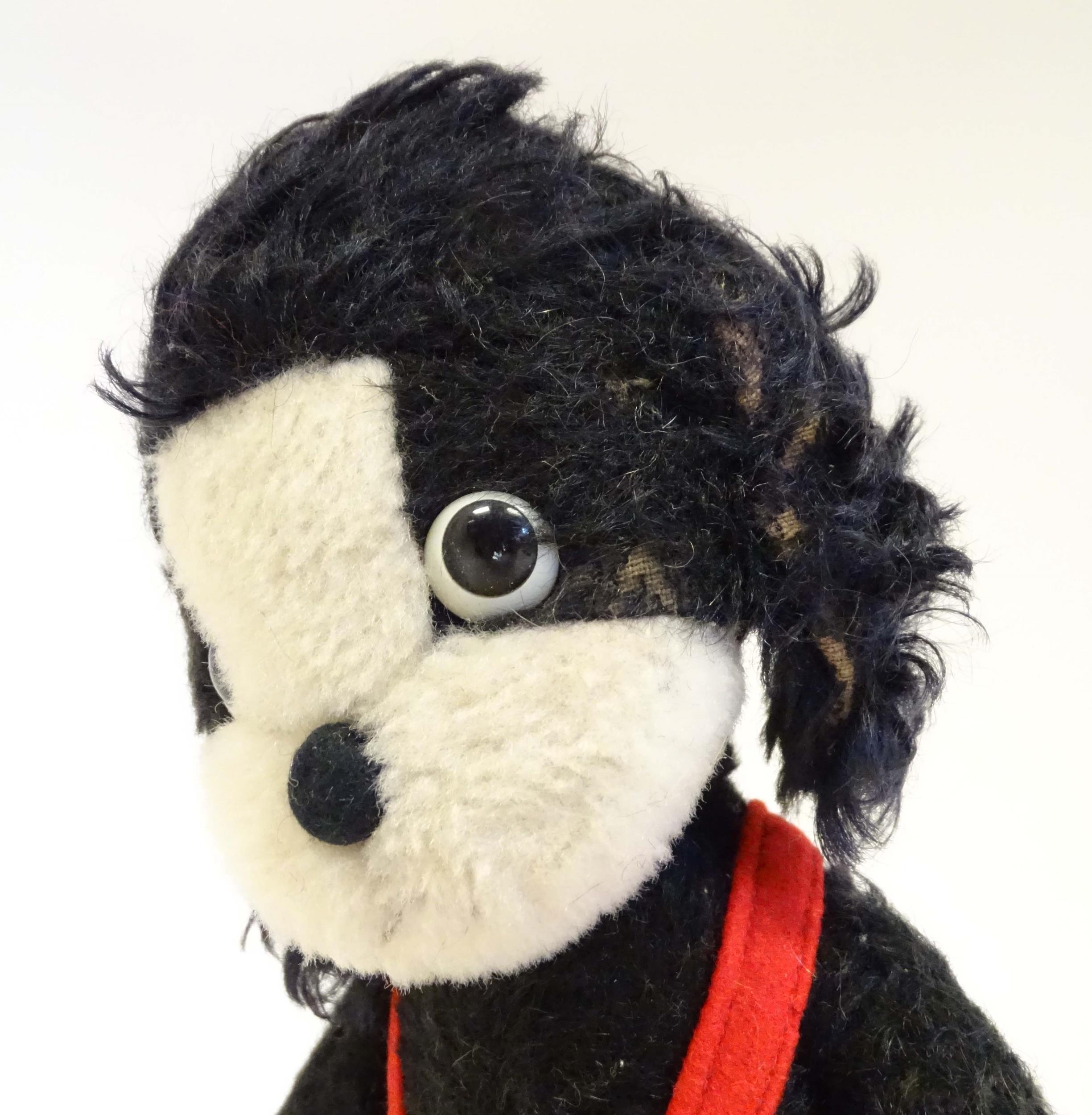 Toy: A mid 20thC Merrythought Mr Twisty stuffed toy dog, bearing label under. Approx. 11" high - Image 4 of 7