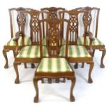 A set of six early 20thC oak Chippendale style dining chairs, having carved decoration to the