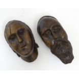 Two early 19thC Continental folk art carved walnut sculptural faces, one depicting a bearded man,