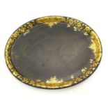 A 19thC papier mache lacquered tray of oval form with gilt floral and foliate decoration. Approx. 19