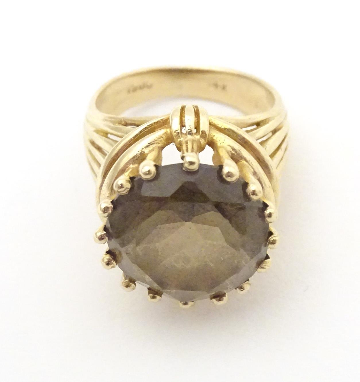 A 14ct gold dress ring set with citrine. Ring size approx K 1/2" Please Note - we do not make