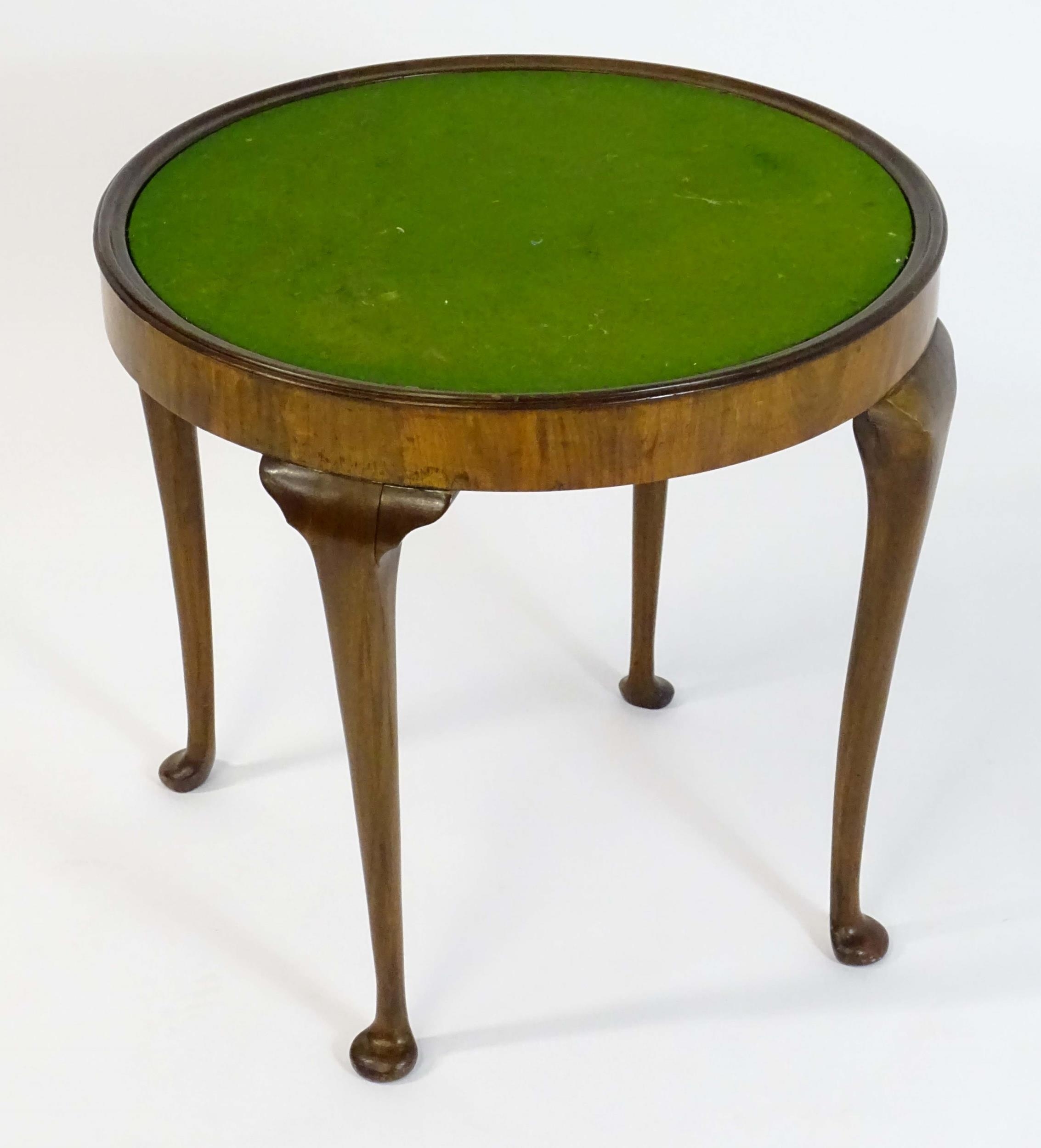 An early / mid 20thC walnut occasional / games table with a reversible top above four cabriole - Image 8 of 8