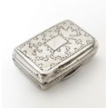 A 19thC silver vinaigrette with engraved decoration opening to reveal gilded interior and grille,