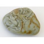 A Chinese jade scroll weight with carved decoration depicting a dragon and horse. Approx. 5" wide