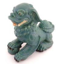 An Oriental model of a guardian lion with a turquoise glaze. Approx. 16" high Please Note - we do