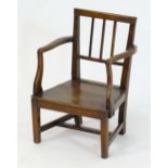 A late 18thC apprentice chair / child's chair of ash, elm and oak construction. 14" wide x 11"