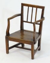 A late 18thC apprentice chair / child's chair of ash, elm and oak construction. 14" wide x 11"