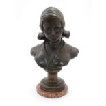 A 20thC Continental cast bronze bust depicting a young Dutch woman in a cloth cap, after Augusts