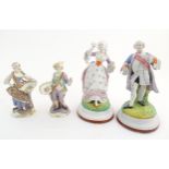 A pair of Continental porcelain figures modelled as a lady and gentleman with flower baskets.