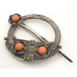 A Victorian Irish / Celtic white metal tara brooch set with three coral cabochon. Marked West & Son,