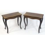 A pair of 19thC rosewood card tables of serpentine form, having beaded edges above floral carved