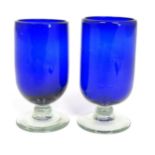 Two Bristol blue style pedestal vases / glasses on a clear glass foot. The tallest approx 6 1/2"