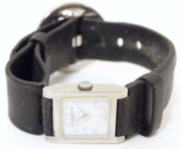A Baume & Mercier Vice Versa quartz wrist watch, the case signed and numbered having a black leather