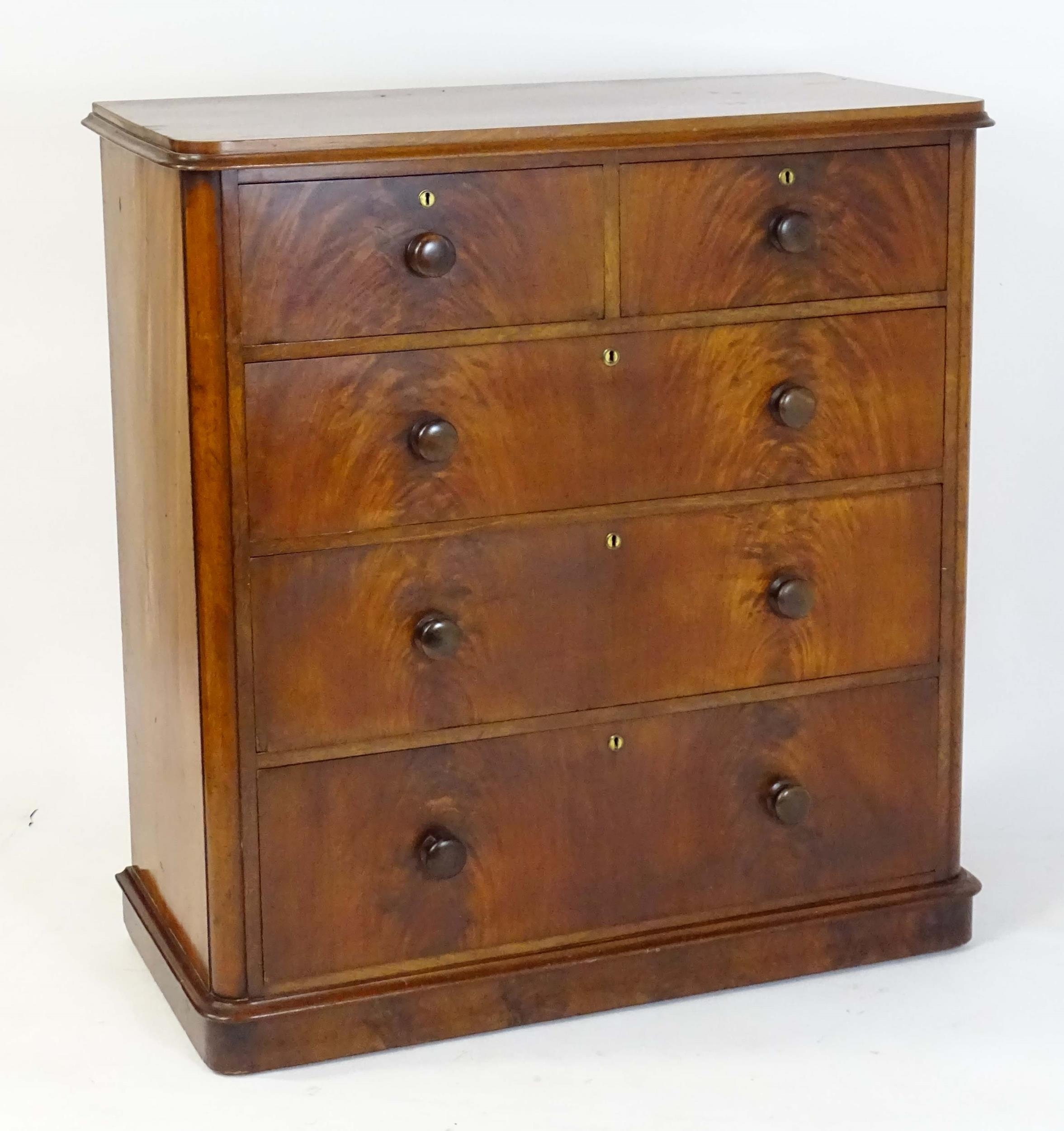 A large Victorian mahogany chest of drawers with a moulded top above two short over three long - Image 4 of 13