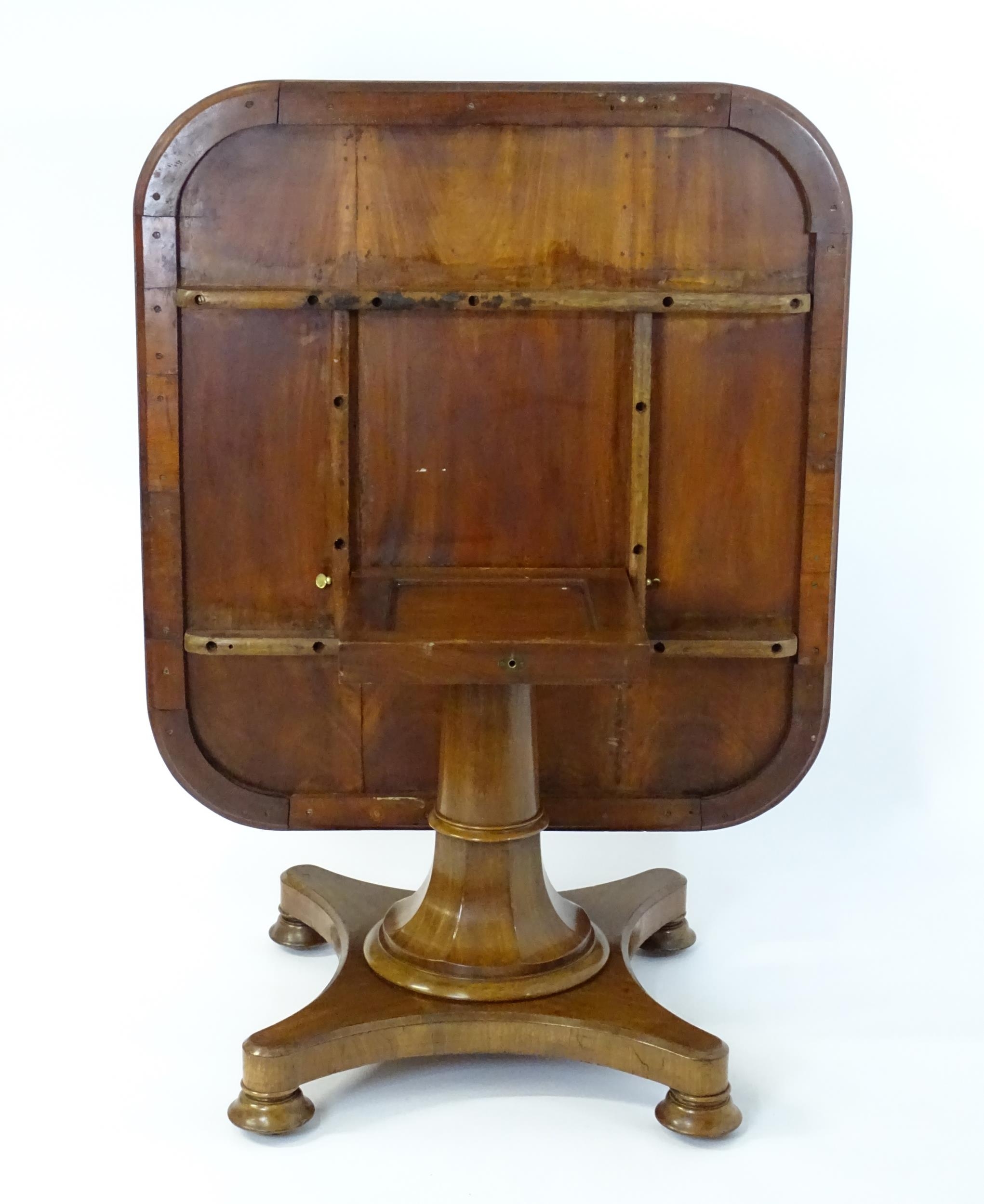 A Victorian mahogany tilt top table with rounded edges and standing on a pedestal base with - Image 8 of 8
