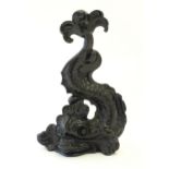 A cast iron door stop / porter modelled as a Georgian dolphin. Approx. 14 1/2" high Please Note - we