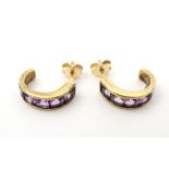 A pair of 9ct gold earrings set with amethyst. Please Note - we do not make reference to the