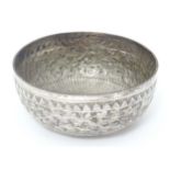 A white metal bowl with acanthus scroll detail, possibly Indian. Approx. 4 1/2" diameter Please Note