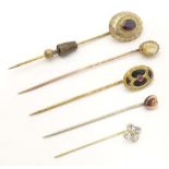 Five assorted 19thC and later stick pins to include one set with bloodstone and central garnet,