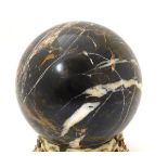 A polished specimen hardstone sphere. Approx. 7 1/4'' Please Note - we do not make reference to