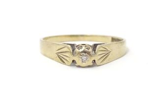 A 9ct gold ring set with central diamond. Ring size approx. J 1/2 Please Note - we do not make