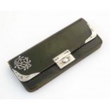 A Victorian green leather purse of rectangular form retailed by Mappin Brothers, 66 Cheapside,