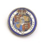 A silver brooch formed from a Geo III 1816 coin with enamel decoration. 1" diameter Please Note - we