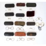 A quantity of late 19thC and later pince nez spectacles / glasses. The largest 4 1/8" wide (14)