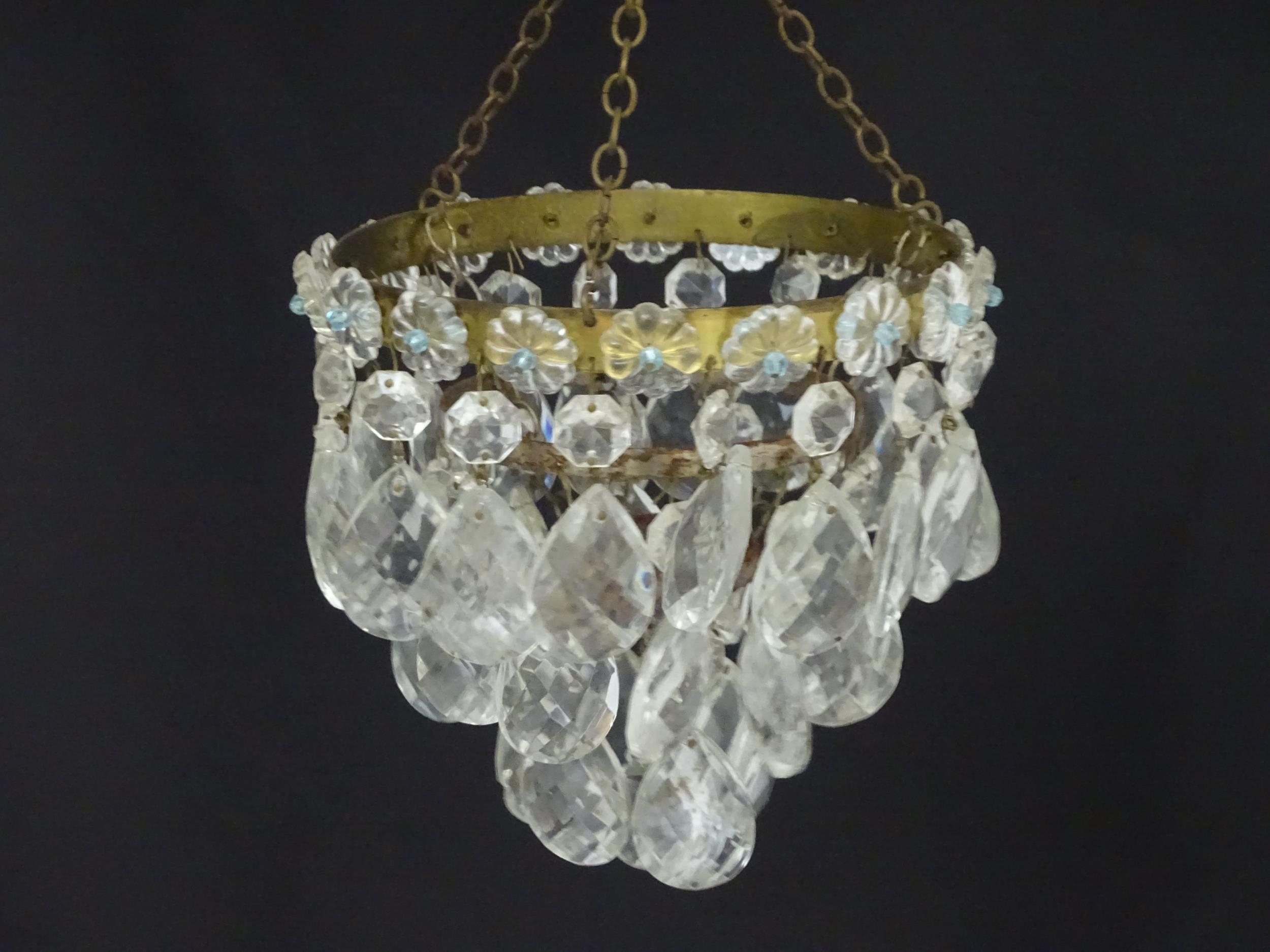 An early 20thC crystal drop bag pendant chandelier, the circular gilt metal mounts supporting - Image 3 of 5