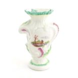 A Rococo style vase of asymmetric form decorated with hand painted landscape scenes in the Derby