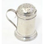 A silver pepper formed as a flour shaker with loop handle. Hallmarked Birmingham 1901 maker Thomas