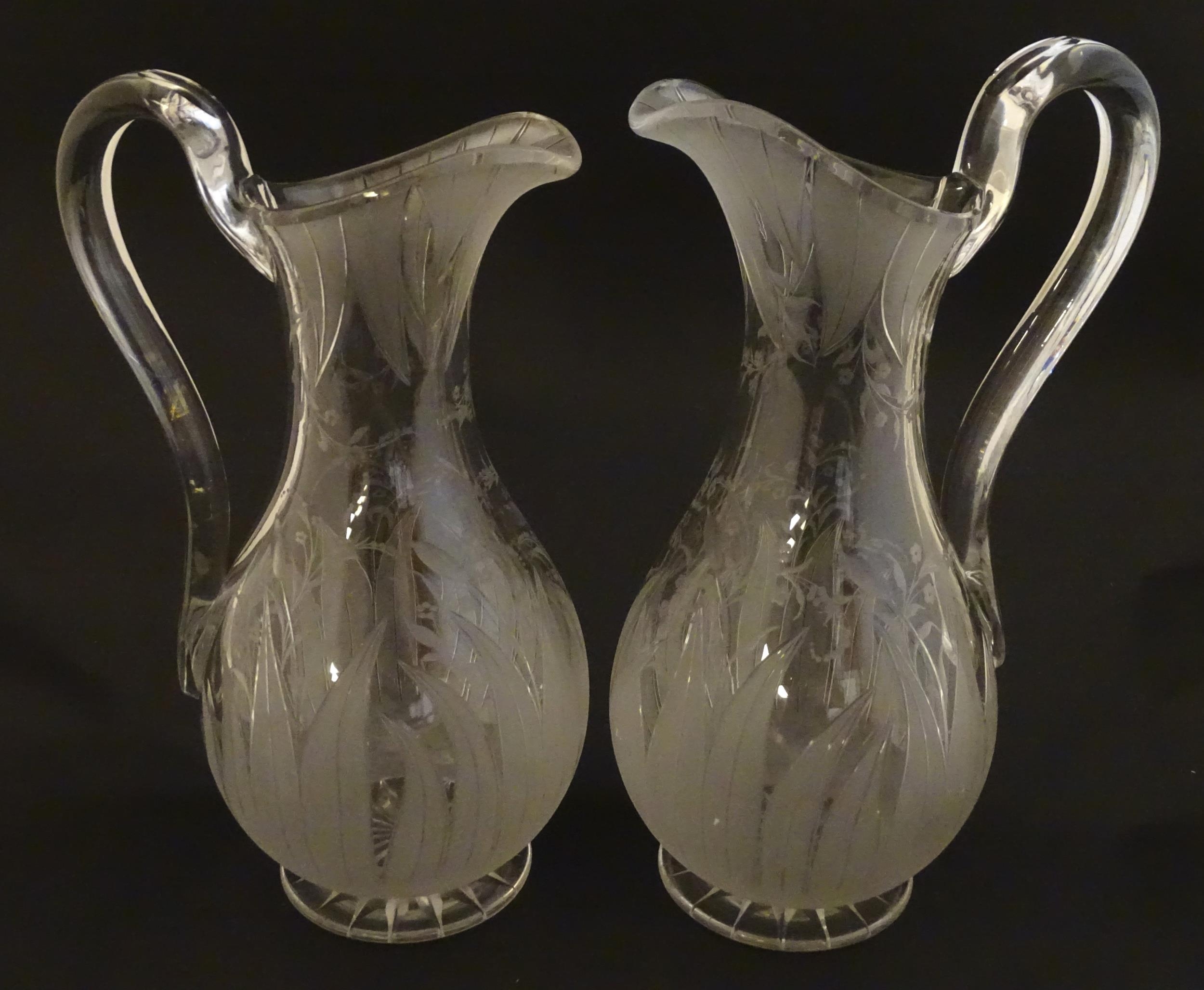 A pair of 19thC jugs with etched decoration depicting floral and foliate detail probably by - Image 3 of 9