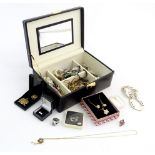 A jewellery box containing a quantity of assorted jewellery to include costume jewellery, silver
