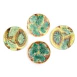 Four Victorian majolica leaf plates of circular form two with Begonia leaves, and two with