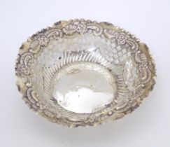 A Victorian silver bon bon dish of circular form with embossed and pierced decoration, hallmarked