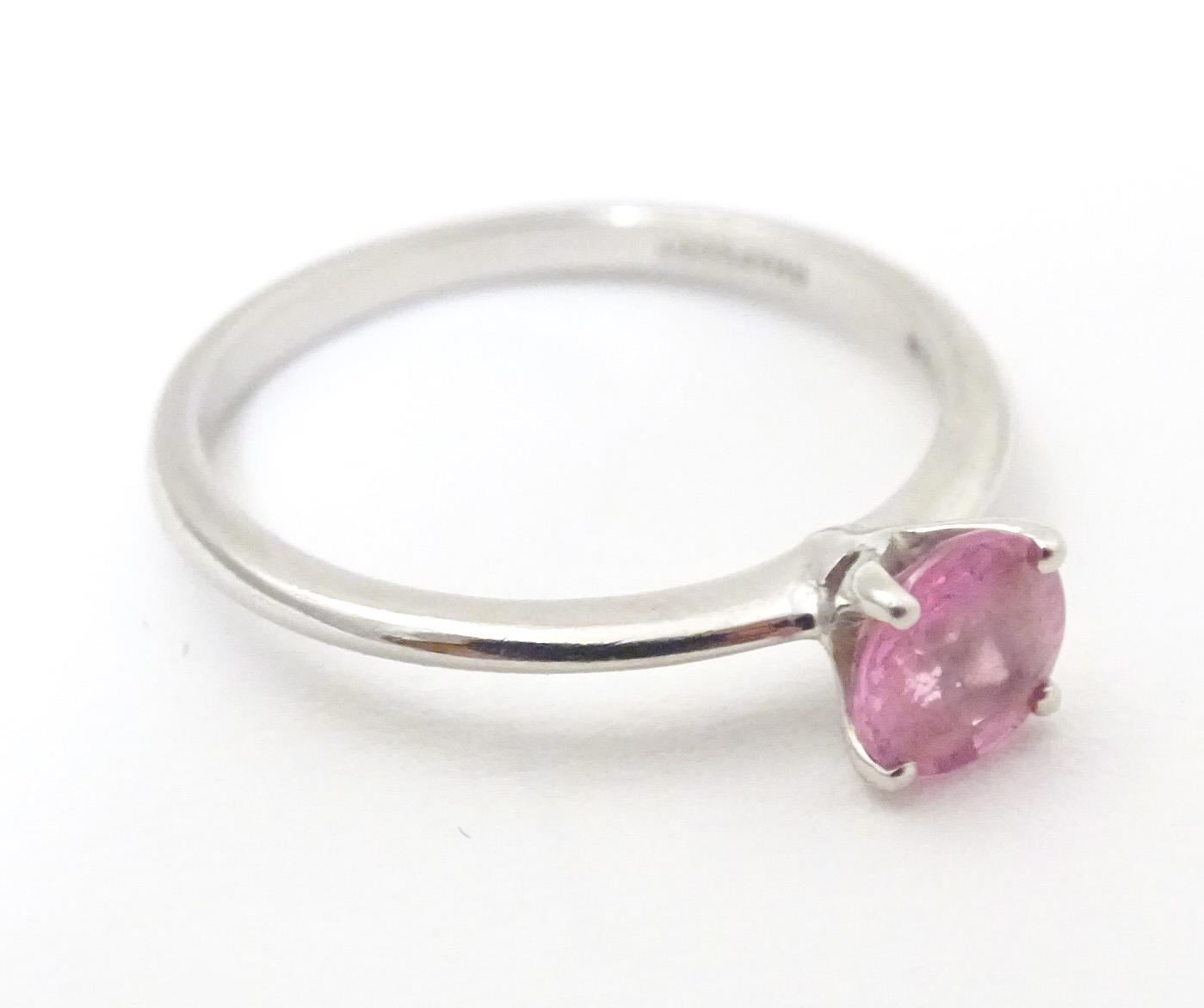A platinum ring set with pink sapphire solitaire. Ring size approx. O Please Note - we do not make - Image 5 of 7