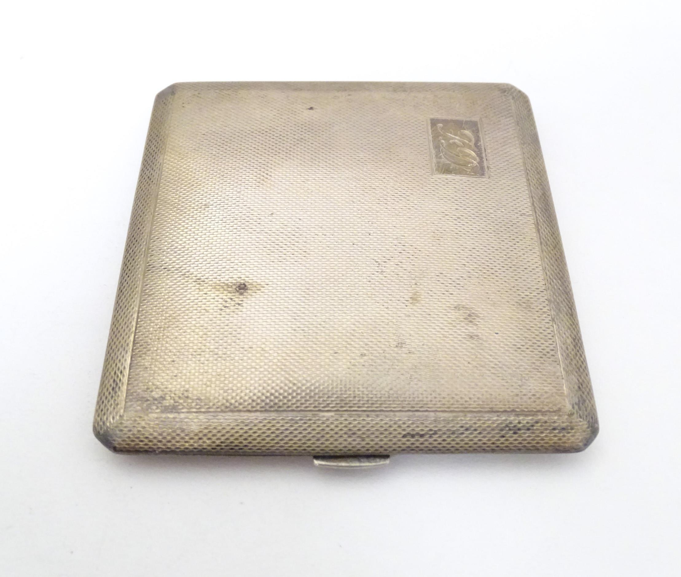 A silver cigarette case with engine turned decoration and gilded interior, hallmarked Birmingham - Image 3 of 10