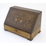 A 19thC Continental olivewood stationery box with letter rack within, with inlaid decoration