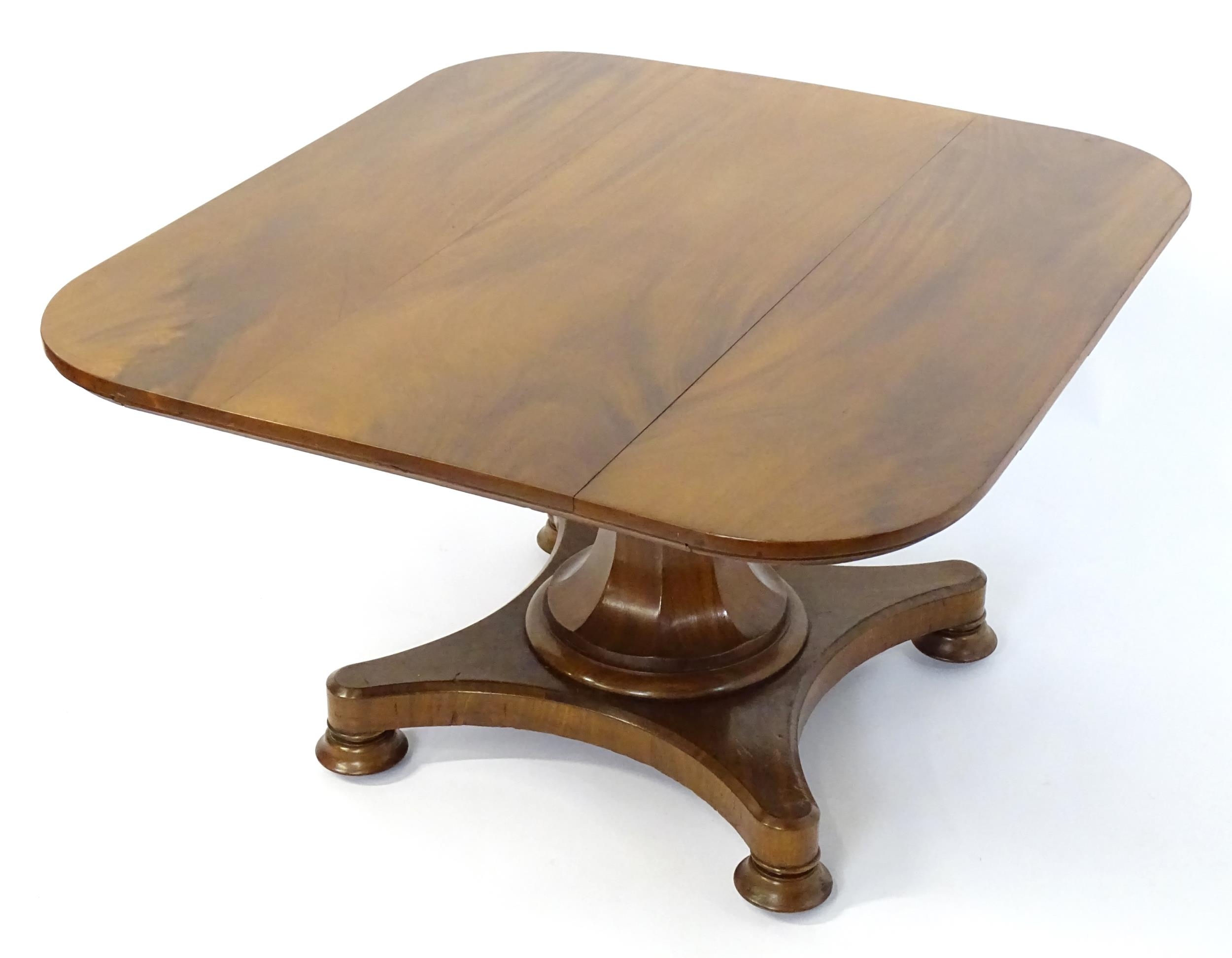 A Victorian mahogany tilt top table with rounded edges and standing on a pedestal base with - Image 6 of 8