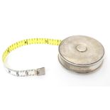 A Continental silver cased tape measure Approx. 2" diameter Please Note - we do not make reference