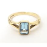 A 9ct gold ring set with aquamarine. Ring size approx L 1/2 Please Note - we do not make reference