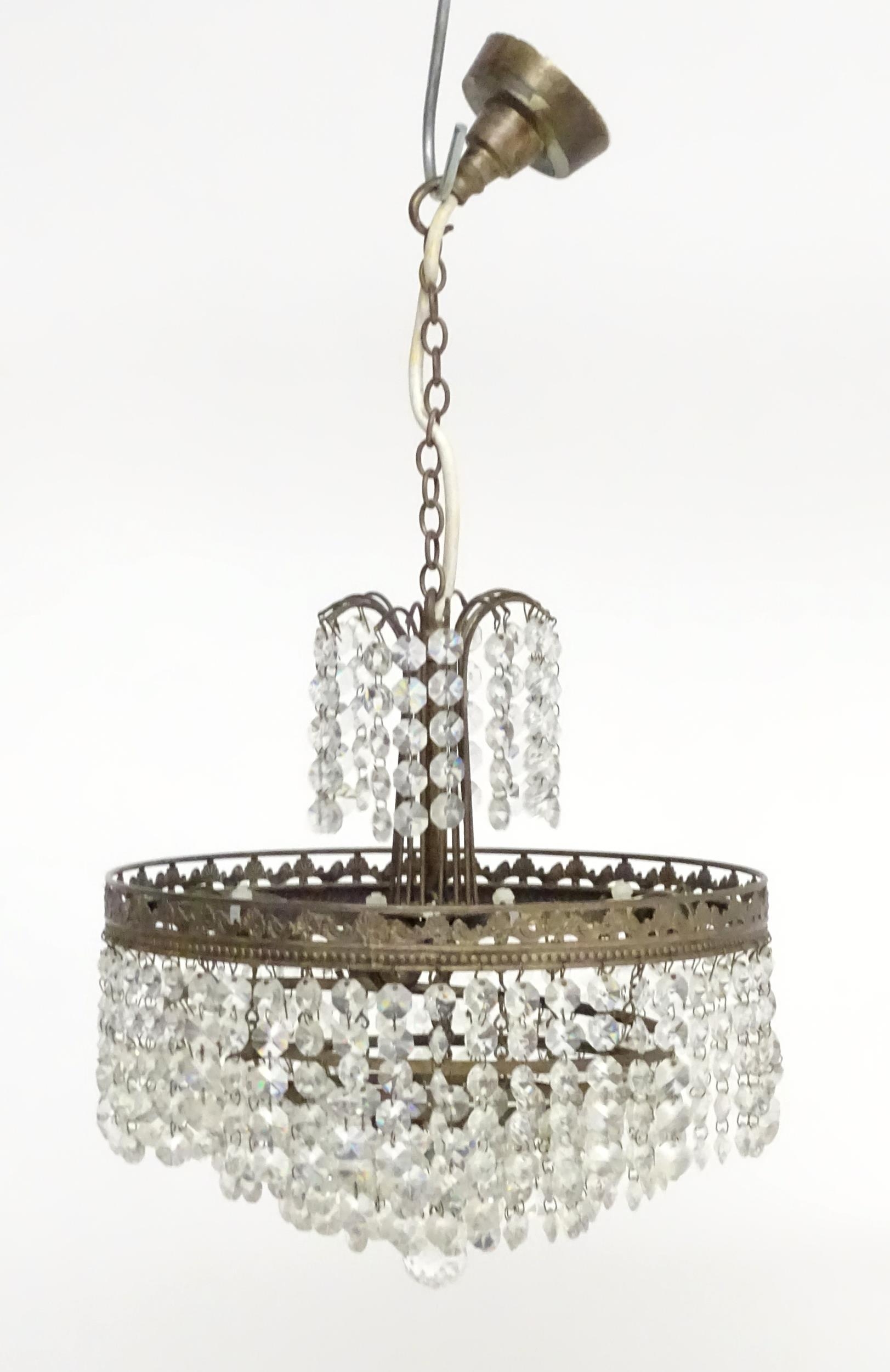 An early 20thC crystal drop bag pendant ceiling light, the chain supporting brass mounts with a - Image 2 of 8