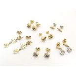 Six pairs of assorted stud earrings to include some gold and yellow metal examples. Please Note - we