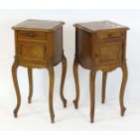 A matched pair of early 20thC Louis XV style bedside cabinets, each having a marble top above a