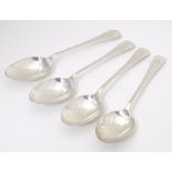 A set of four silver table spoons hallmarked London 1934, maker Kemp Brothers. Approx. 8 1/2"