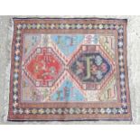 Carpet / Rug : A rug with blue, red, cream and beige ground, decorated with stylised birds and