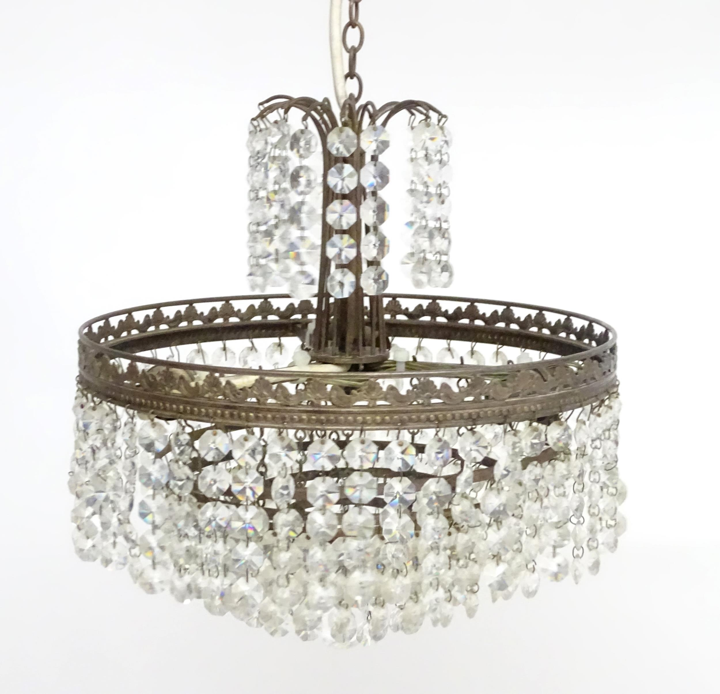 An early 20thC crystal drop bag pendant ceiling light, the chain supporting brass mounts with a - Image 8 of 8