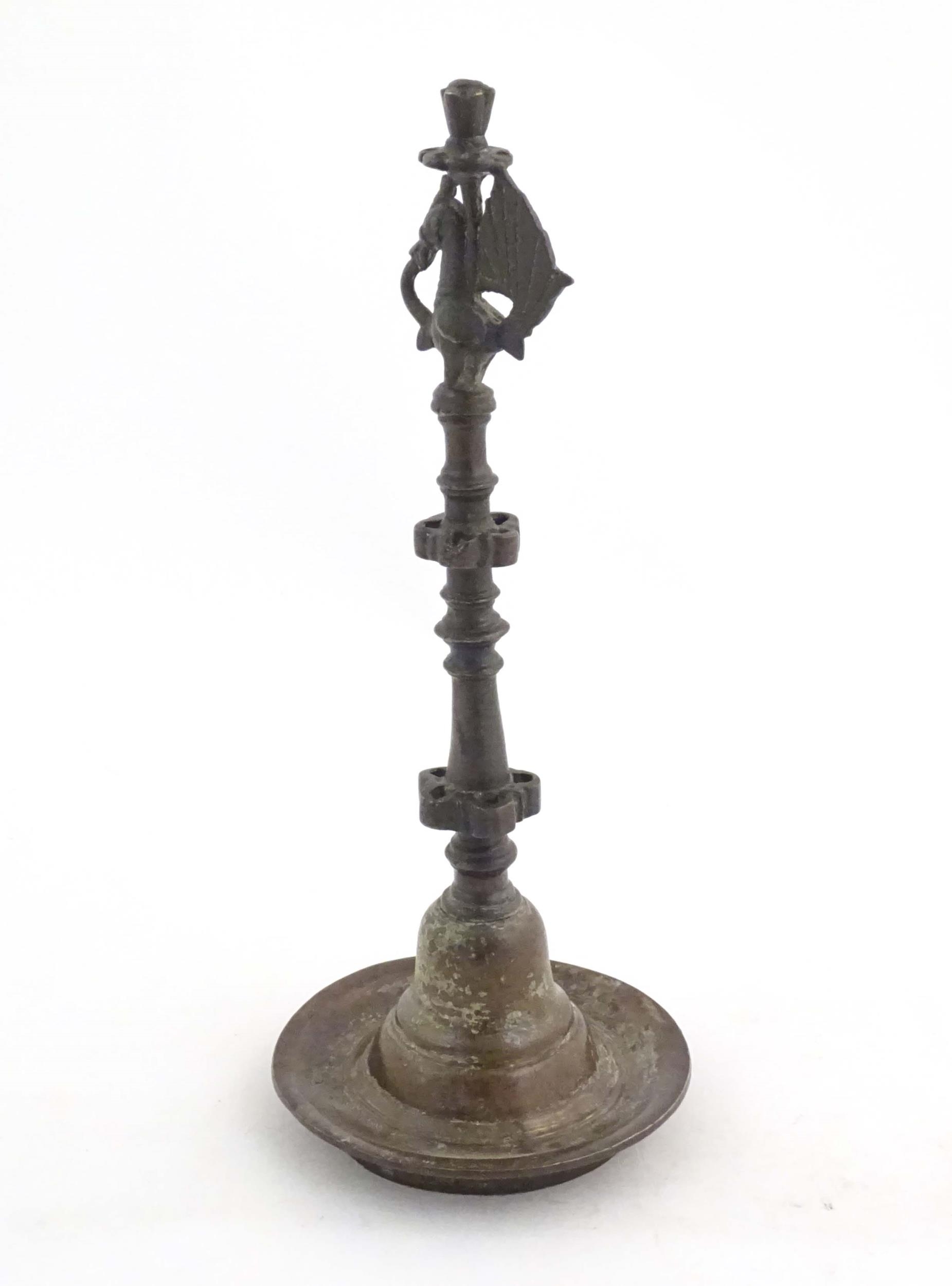 An Indian / Deccan cast temple style oil lamp with turned column surmounted by a Hamsa bird. Approx. - Image 5 of 8