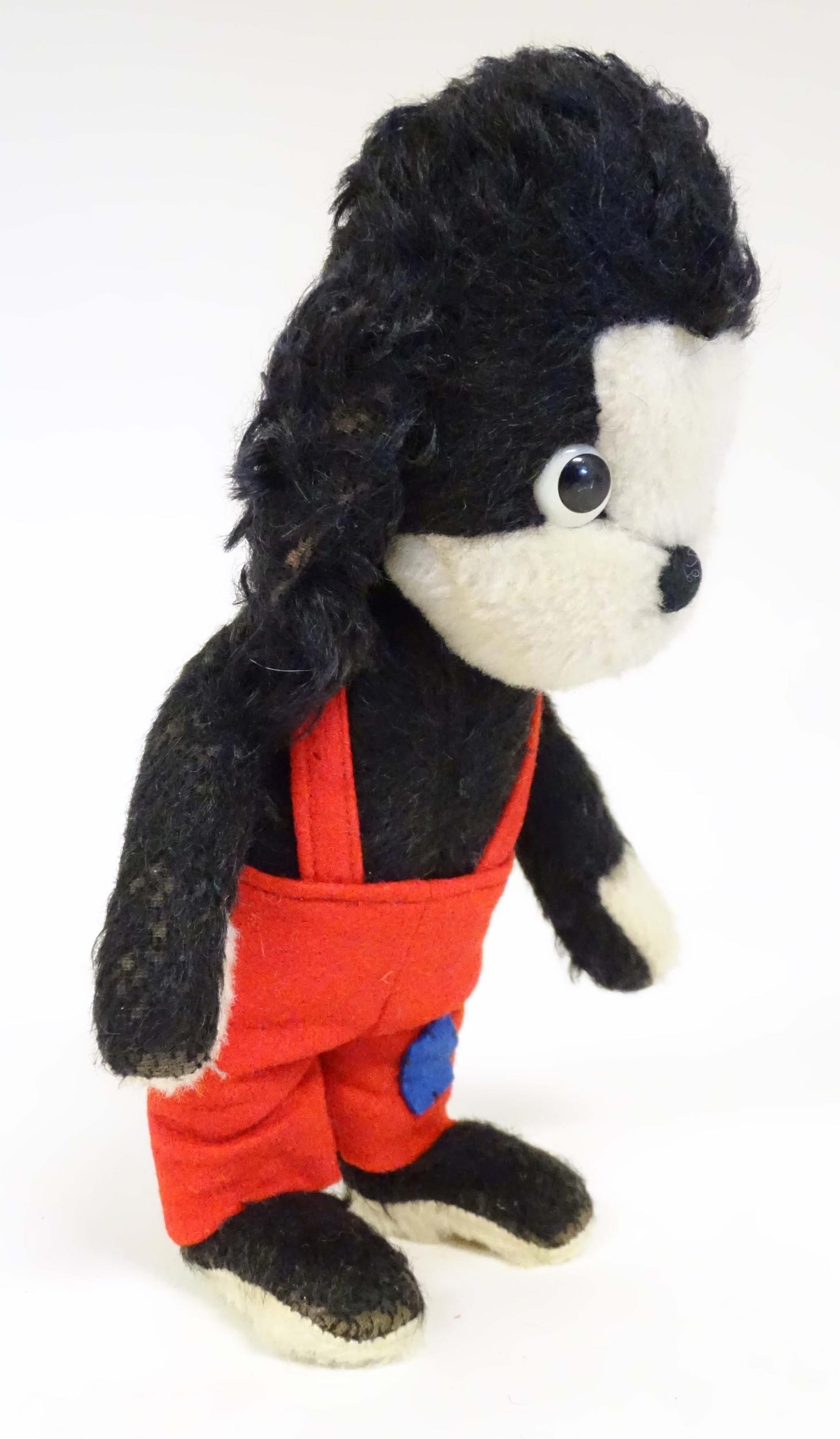 Toy: A mid 20thC Merrythought Mr Twisty stuffed toy dog, bearing label under. Approx. 11" high - Image 2 of 7