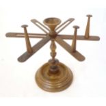 A 19thC worktop wool winder / yarn swift spinner, constructed from turned walnut, standing 9 3/4"